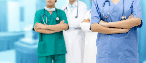 General surgeons standing with arms folded.