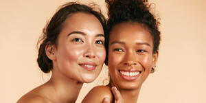 Two women after undergoing plastic surgery treatment for the face.