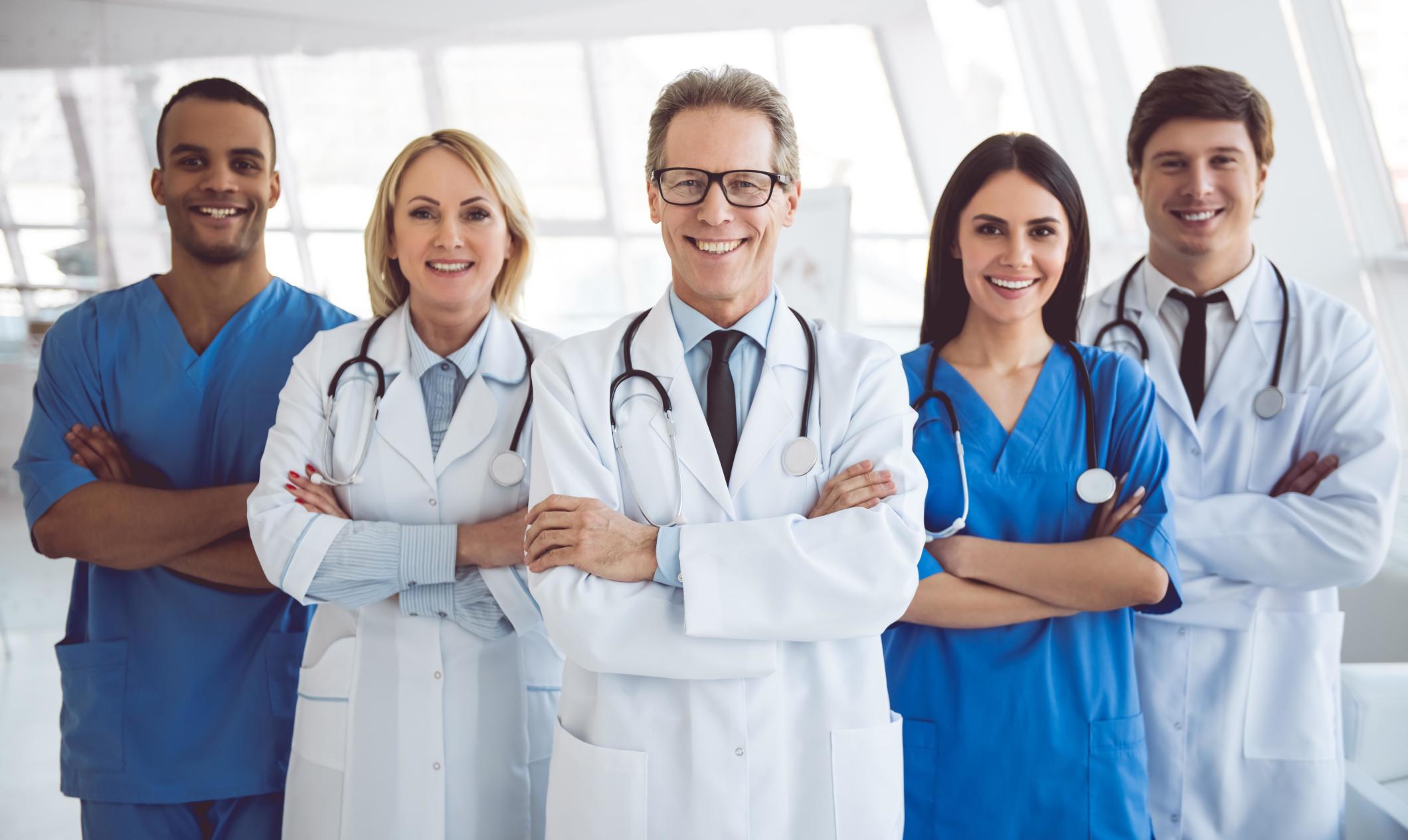 Weight loss surgery doctors smiling at hospital.