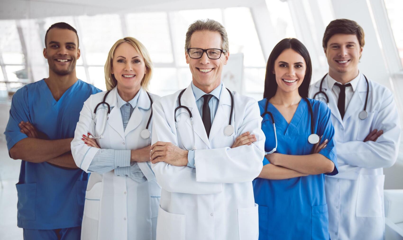 Weight loss surgery doctors smiling at hospital.