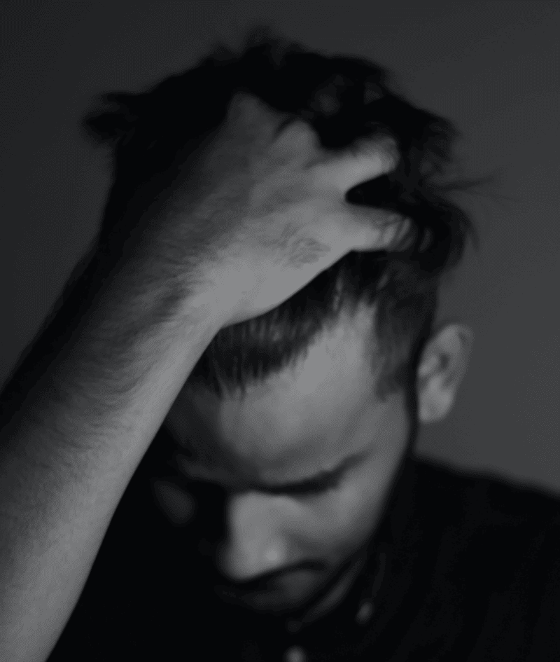 Sweeping a hand over a slightly receding hairline