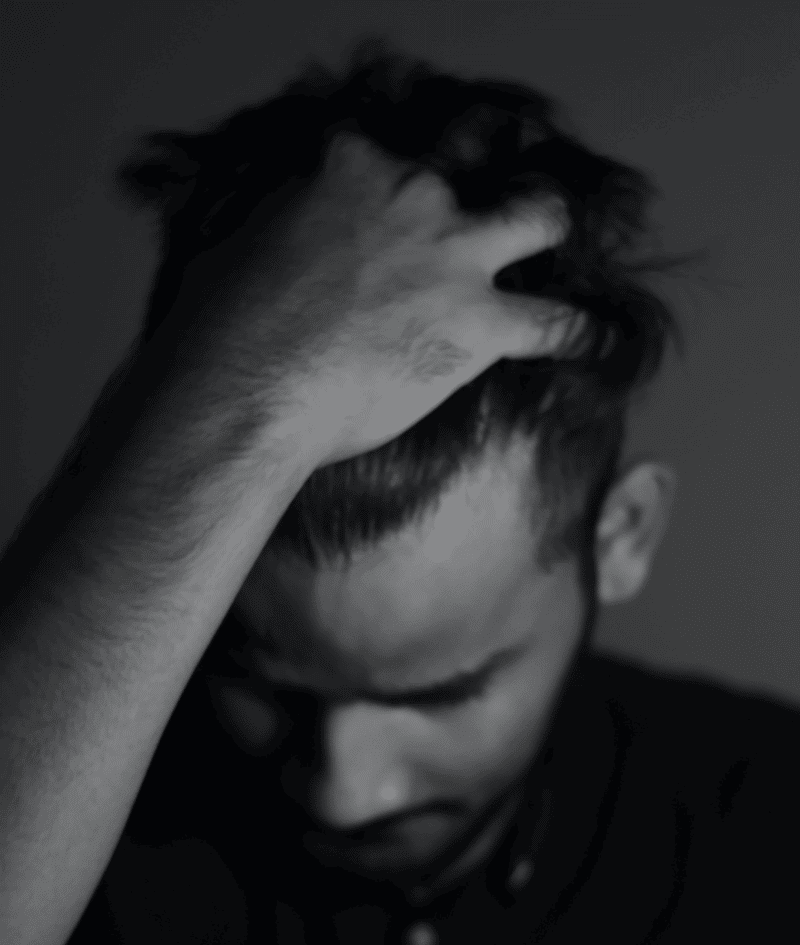 Sweeping a hand over a slightly receding hairline