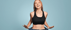 Happy woman after non-reversible weight loss surgery.