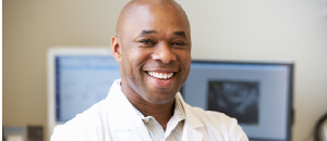 Happy male doctor for vasectomy fertility treatment.