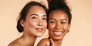 Two women after undergoing plastic surgery treatment for the face.